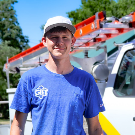 GBT Tech Jadon in front of his truck.